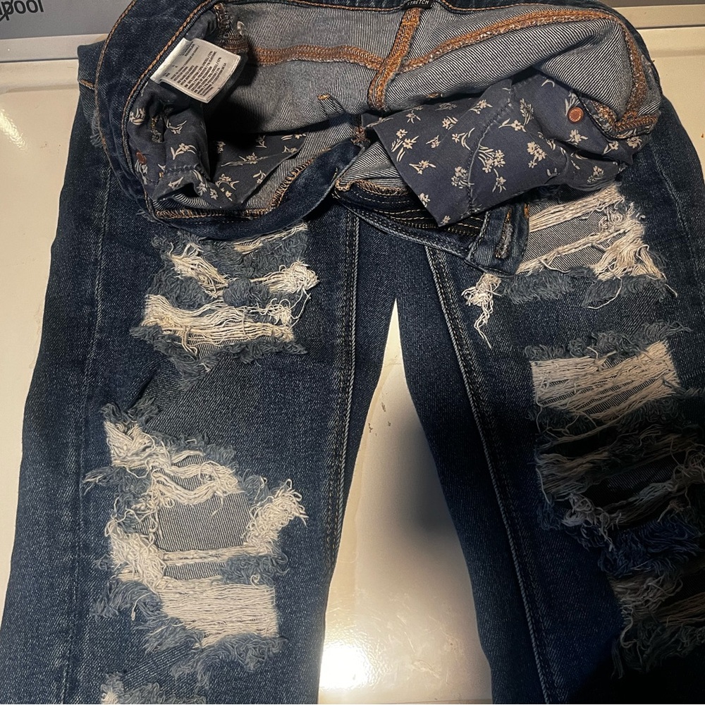 Distressed Blue Jeans